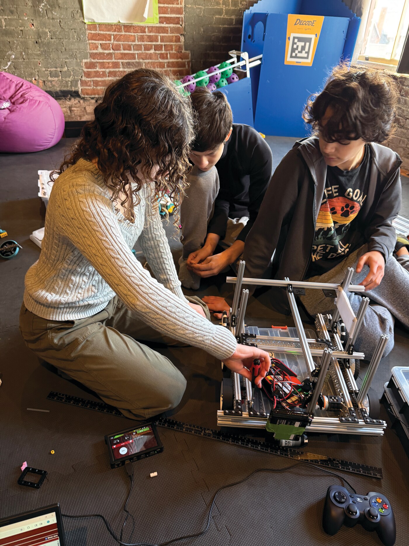 Young people building a robotics project at Newburgh Creates