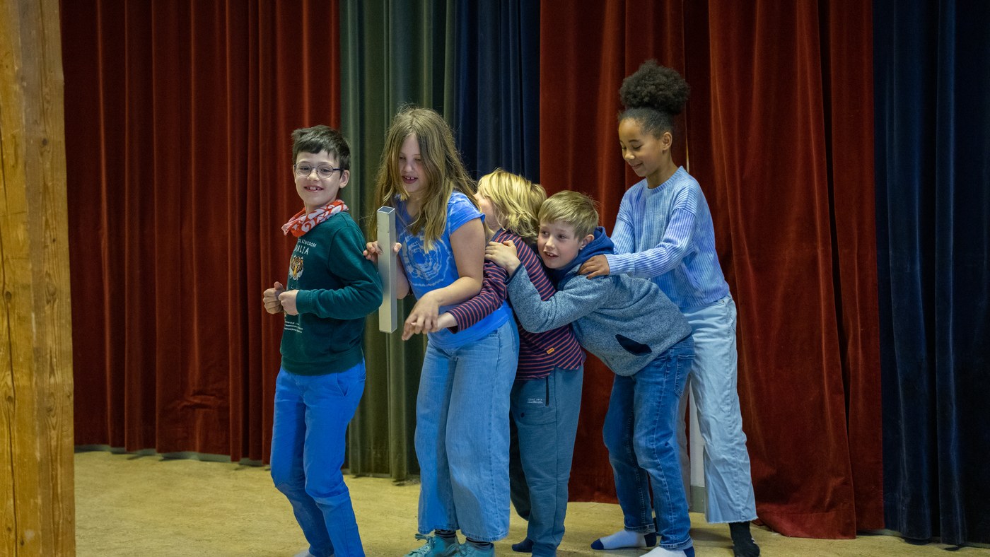 Young people performing together on stage
